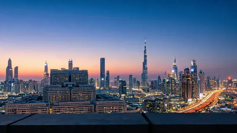 Dubai skyline at dusk showing the contrast between formal government district and vibrant commercial towers, representing the dual legal and marketplace reality in the UAE