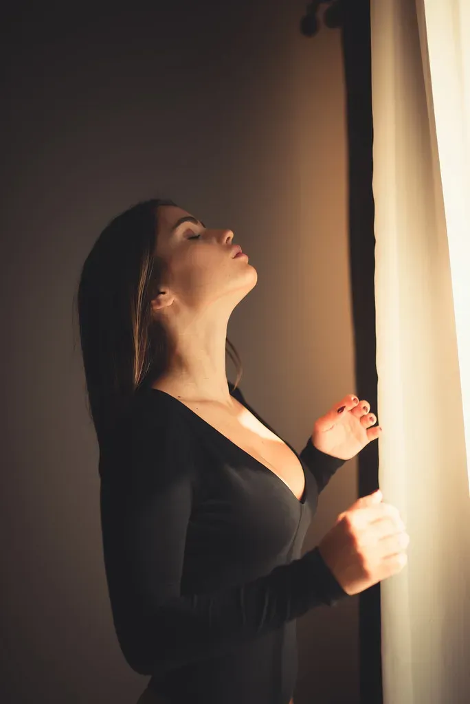 A calm, reflective portrait illustrating arousal non-concordance, the normal gap between the body's physical arousal and the mind's subjective desire.
